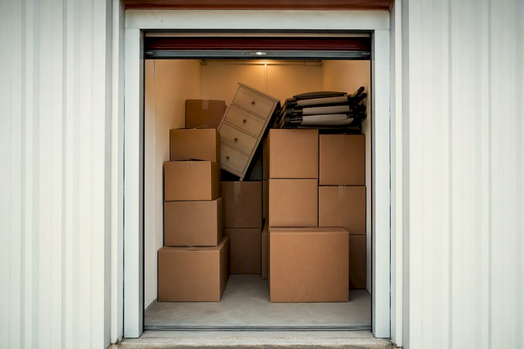 Small storage unit with dresser and boxes