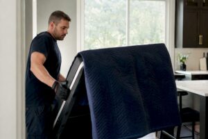 Mover angling treadmill in home hallway