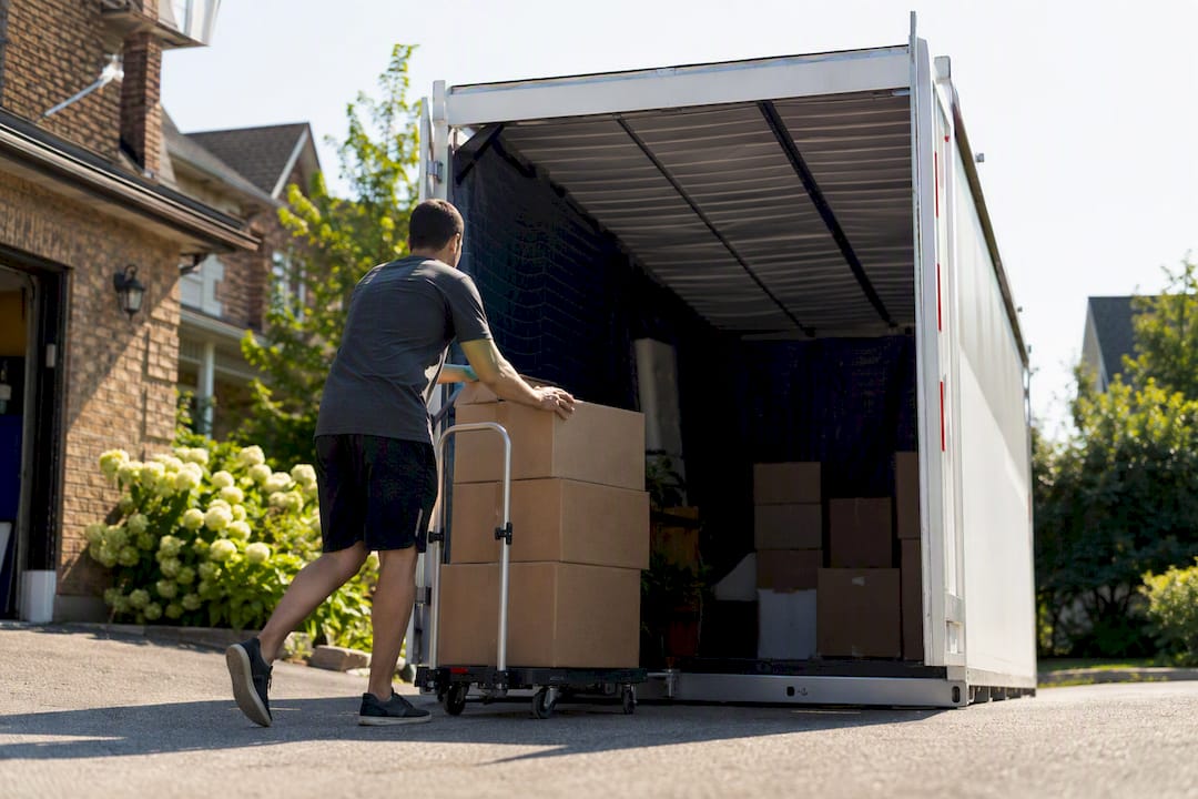 Loading boxes into portable moving container