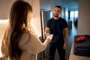 Homeowner offering gratuity to moving crew