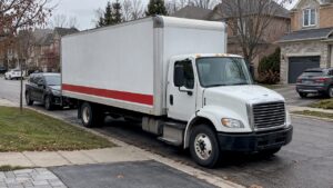 Moving truck occupying an Oakville curb